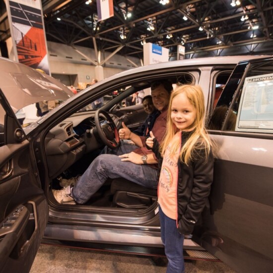 Family sitting in a Honda