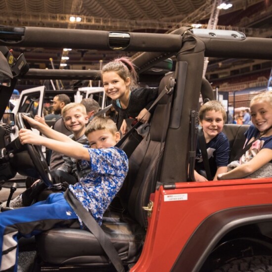 Kids in a Jeep on display